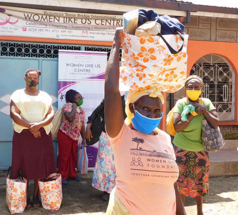 Women from the Center receiving groceries during COVID-19 pandemic