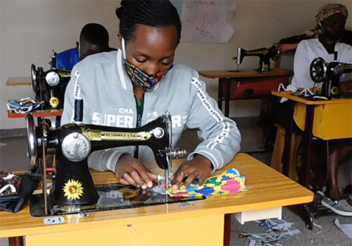 Woman learning to sew at the Women Like Us Center in Nakuru, Kenya